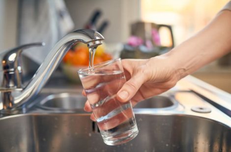 filling a glass of water in the sink