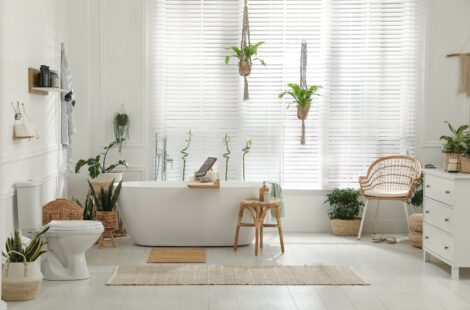 White bathroom with house plants throughout