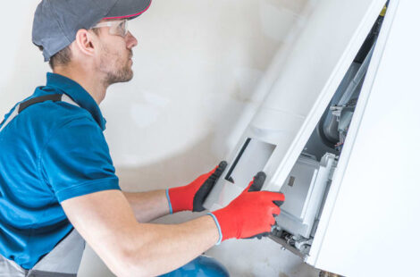 HVAC technician checking furnace