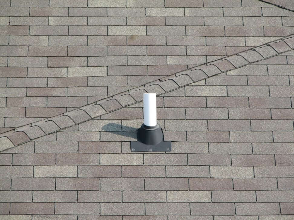 Plumbing vent pipe on roof