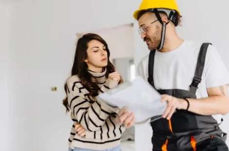 A person going through what professional plumbing repair services cover in Seattle, Washington