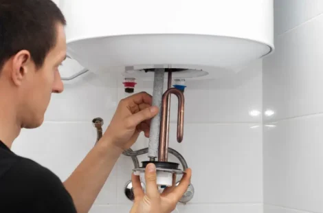 A person replacing a water heater in Seattle, Washington