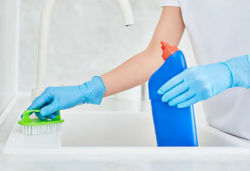 A person using drain cleaner in Seattle, Washington